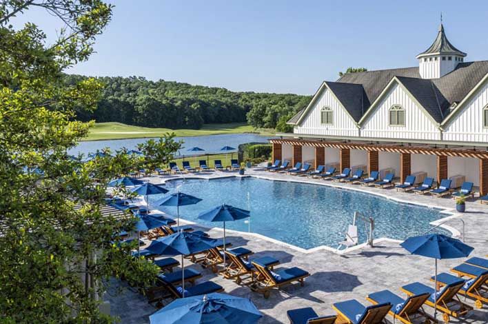 MICS Karaoke with a prominent "MICS" logo on a red-lit wall, reflective surfaces, blue accent lights, and TV screens displaying Asian text.